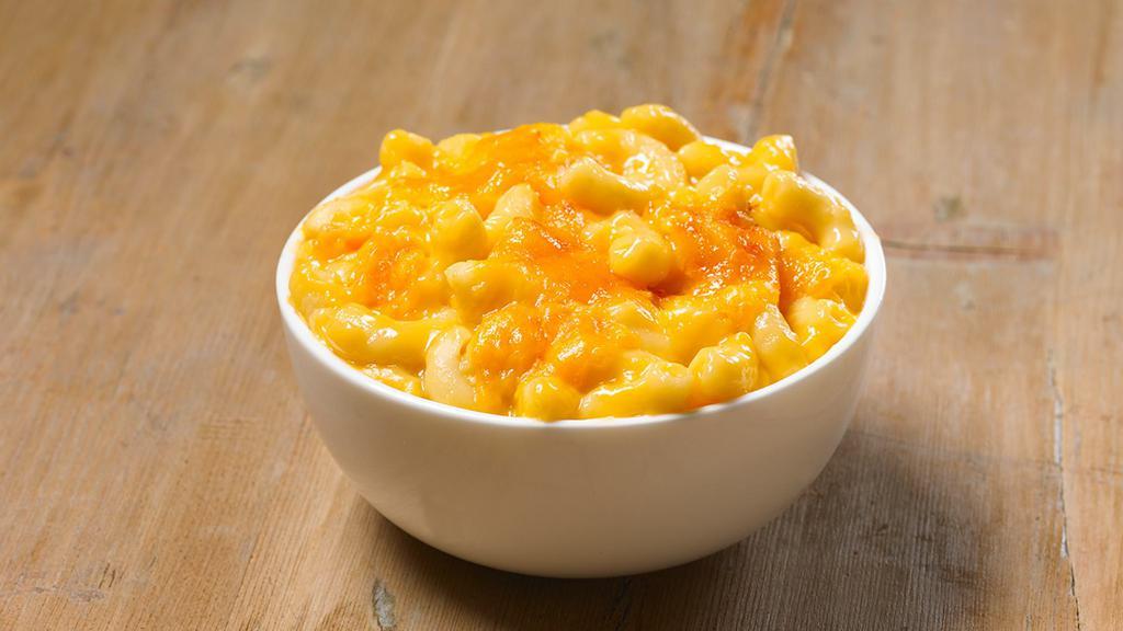Baked Mac & Cheese (Regular) · We take mac & cheese, sprinkle shredded cheddar cheese on top, then bake it to golden perfection. A fork never had it so good.