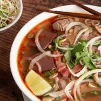 7. Bún Bò Huế  Đặc Biêt New Ca Mau · Popular and famous special Spicy noodle soup w/pork leg, Pork blood, Shanks, Brisket ,tendon...