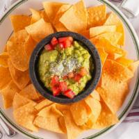 Guacamole · Freshly mashed avocados with onions, cilantro, & serrano chiles. Served with chips & salsa