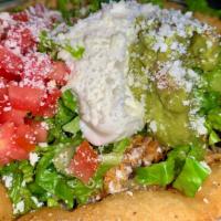 Tostada Bowl  · Corn masa  bowl filled with chicken tinga, black beans, rice, and chopped romaine topped wit...