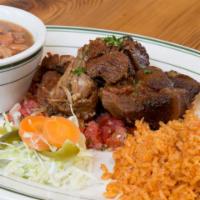 Carnitas · Slow braised pork shoulder in citrus juices, served with Mexican rice and frijoles charros.