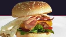 The Rise 'n Shine · Our signature fried chicken served on a toasted bun and topped with bacon, cheddar cheese, m...