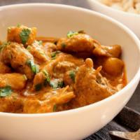 Chicken Curry · Hearty chicken cooked in a savory onion and tomato curry flavored with traditional Indian sp...