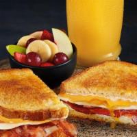 Breakfast N' Bread Melt - Combo · Bacon, eggs, American and Swiss cheeses and mayo on grilled artisan bread. All the breakfast...