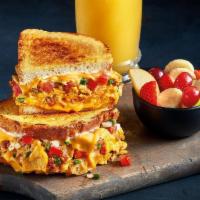 Rise 'N Spice Melt -Combo · Chorizo, Cheddar cheese, tortilla chips all scrambled with eggs and topped with American che...