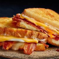 Breakfast N' Bread Melt · Bacon, eggs*, American and Swiss cheeses and mayo on grilled artisan bread. All the breakfas...