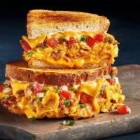 Rise 'N Spice Melt  · Chorizo, Cheddar cheese, tortilla chips all scrambled with eggs and topped with American che...