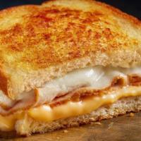 Tiny Turkey Melt · Turkey, American cheese and sharp white Cheddar on grilled artisan bread. Sized just right f...