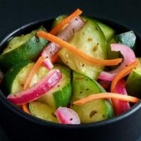 Pickled Cucumber Salad (Bowl)  · A house-made tangy side of pickled cucumbers plus carrots and onions.