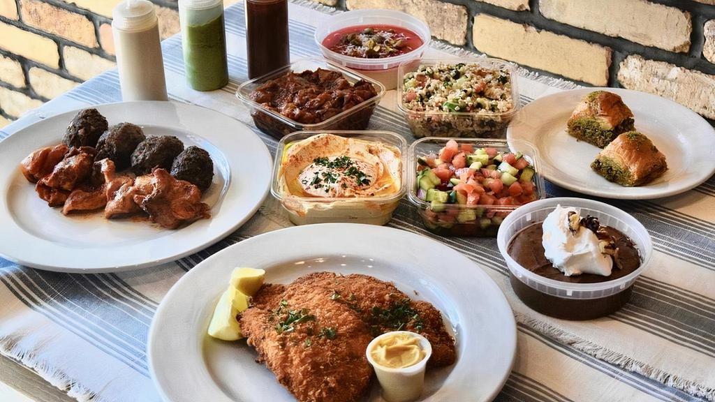Orens Family Meal · Generously serves 3 - 4 . Choose any combination of skewers and schnitzel along with Hummus, Green Cabbage, Israeli Salad, Traditional Tabouli, one dip or side, and two desserts of your choosing. Pita bread and sauces included.