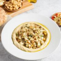 Hummus Cauliflower · Hummus with roasted cauliflower, golden raisins, toasted almonds, and chives (gf)
