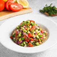 Large Israeli Salad · Chopped cucumber, tomato, red onion, and parsley, served with lemon vinaigrette.  (gf, v)
