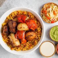 Rice Bowl w/ Veggie Skewer · Turmeric spiced Basmati rice simmered with tomatoes, garlic, onions, mint, and parsley. Topp...