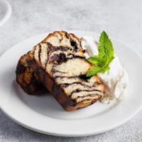 Chocolate Babka · (Two slices). Layers of chocolate and buttery brioche served warm then topped with whipped c...