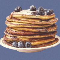 Blueberry Pannies · 2 blueberry pancakes served with maple syrup, blueberries, butter, and dusted with powdered ...