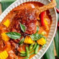 Pineapple Duck Curry · Spicy. Gluten-free. Mussamun coconut curry with crispy duck, bell peppers, pineapple, green ...
