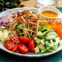 Ginger salad (V) · Vegan. Lettuce, fresh ginger, cucumber, beet, crispy taro, green onion, red onion, dry cranb...