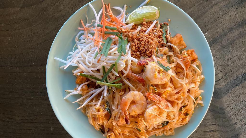 Pad Thai · Wok-fried thin rice noodles with tofu, eggs, bean sprouts, chives and crushed peanuts in tamarind sauce.