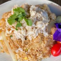 Crab Fried Rice · Fried rice loaded with crab meat, eggs, garlic, onions, tomato and green onion. Gluten free.