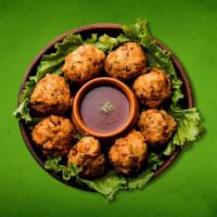 Seasoned Veggie Poppers  (Vegan) · A medley of onions hand-made fresh to order then dipped in chickpea & rice flour batter and ...