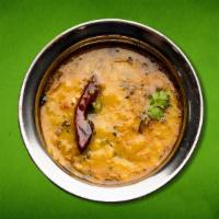Divine Daal Yellow  (Vegan) · Yellow Lentil tempered with onion and tomatoes on a low flame with spices