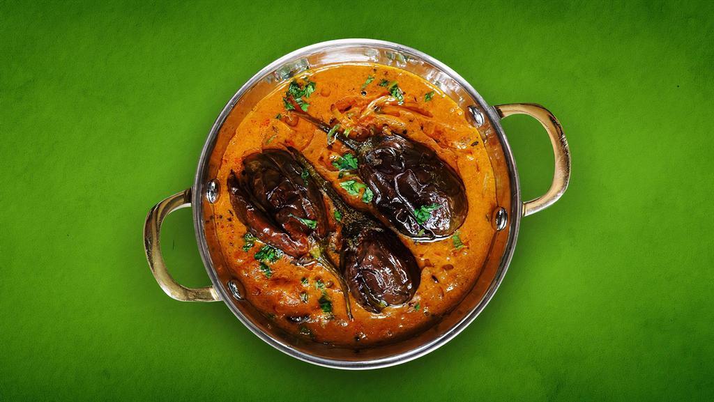 Eggplant Supreme (Vegan) · Eggplant roasted in tandoor and cooked with peas, tomatoes, onions and garlic