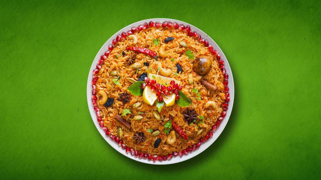 Vegetable Biryani Feast  (Vegan) · Vegetables cooked in a special curry then layered on the basmati rice with a hint of saffron and garnished with cilantro.