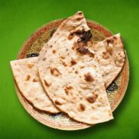 Tandoori Roti (Vegan) · Whole wheat flat bread baked to perfection in an Indian clay oven