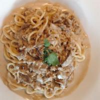 Tonnarelli Alla Capricciosa · Housemade pasta, porcini mushrooms, Italian sausage, cream.
