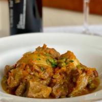 Spezzatino di Vitello Alla Romana · Milk fed veal loin, braised in white wine, veal stock, carrots, potatoes, English peas.