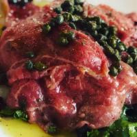BEEF CARPACCIO · Thinly sliced raw beef, topped with capers, olive oil and lemon juice