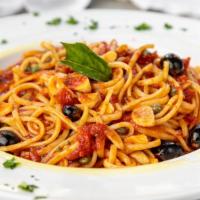 LINGUINE PUTTANESCA · Sautéed anchovies, black olives, capers, garlic, and parsley in a marinara sauce