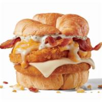 Chick-N-Tater Melt · Crispy chicken, bacon, hashbrown, Swiss cheese, white sauce, shredded cheddar cheese on a cr...
