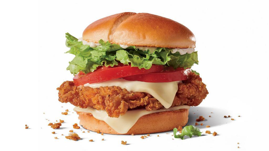Jack'S Spicy Chicken® W/ Cheese · You know Jack’s Spicy ChickenⓇ is delicious when Jack - the man himself - put his name on it. Our new 100% all white meat spicy chicken fillet is bigger, crispier, and better than ever and every bite of this tasty heat wave also has Swiss-style cheese, freshly sliced tomato, lettuce and real mayonnaise all on a buttery bakery bun. Yeah, your stomach owes Jack a thank you card.