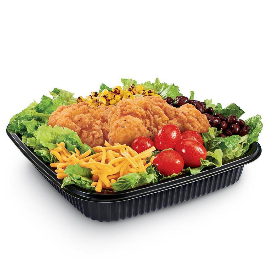 Southwest Chicken Salad (Crispy) · Iceberg and romaine lettuce blend topped with Crispy Chicken Strips, black beans, grape tomatoes, roasted corn, shredded Cheddar cheese, served with creamy Southwest dressing and spicy corn sticks
