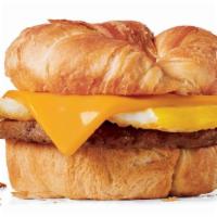 Sausage Croissant · Fried egg, sausage patty and American cheese on a toasted buttery croissant