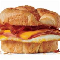 Supreme Croissant · Fried egg, bacon, ham and American cheese on a toasted buttery croissant