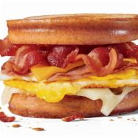 Grilled Sourdough Swiss Breakfast Sandwich · 2 slices of ham, 2 full strips of bacon, 2 fried eggs 1 slice of Swiss cheese and 1 slice of...