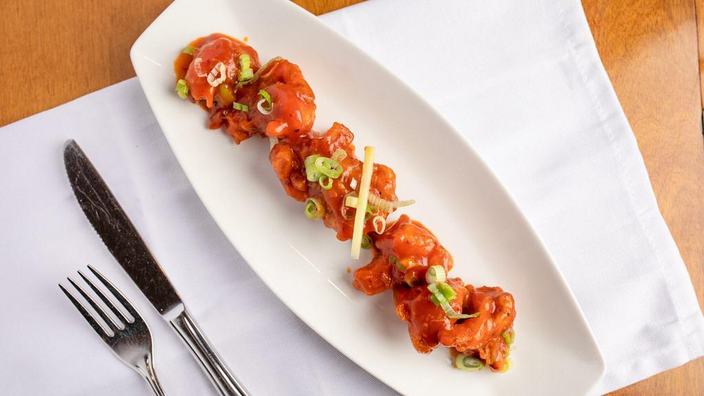 Gobi Manchurian · Deep fried cauliflower tossed with garlic, ginger, green onion, and tangy tomato sauce.