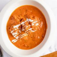 Butter Chicken · Roasted and shredded chicken in creamy tomato sauce.