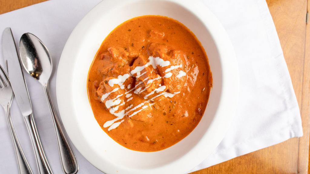 Butter Chicken · Roasted and shredded chicken in creamy tomato sauce.