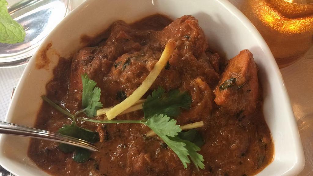 Chicken Tikka Masala · Tandoor roasted chicken breast in onion, garlic, ginger, and fresh tomato sauce.
