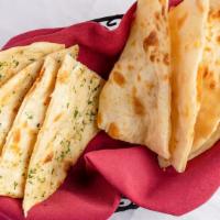 Garlic Parsley Naan  · All-purpose flour bread with garlic parsley topping.