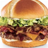 The Southern Charm Burger® · Brown sugar glaze, candied bacon, Whiskey River® BBQ Sauce, Cheddar, caramelized onions, let...