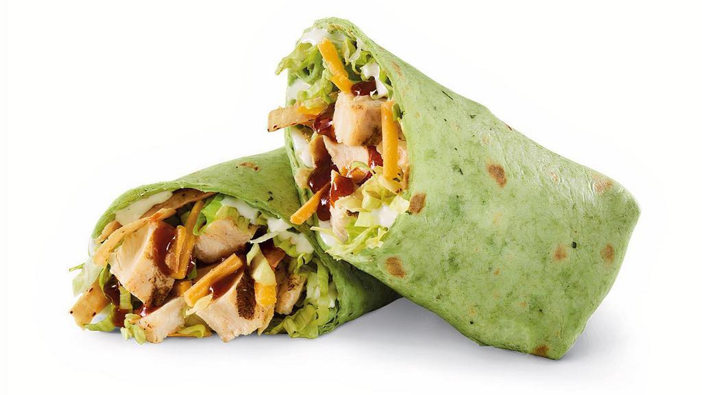 Whiskey River® Bbq Chicken Wrap · Sliced chicken breast, Whiskey River® BBQ Sauce, Cheddar, lettuce, tortilla strips and ranch in a spinach tortilla..