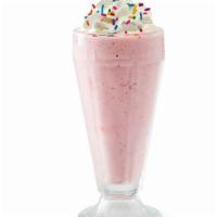 Strawberry Milkshake · Creamy soft-serve blended with milk and strawberry. Garnished with whipped cream and rainbow...