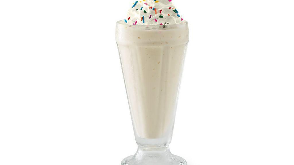 Vanilla Milkshake · Creamy soft-serve blended with milk and vanilla syrup. Garnished with whipped cream and rainbow sprinkles.