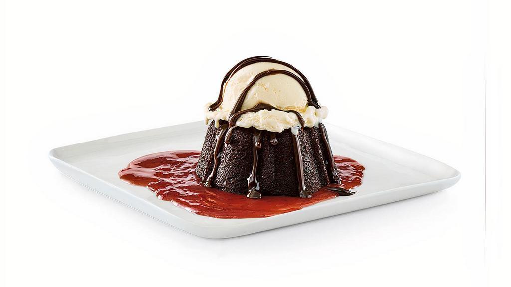 Gooey Chocolate Brownie Cake · Chocolate brownie cake with hot fudge and strawberry puree, served à la mode.. Comes cold, heat at home in your microwave on high for 30 seconds.