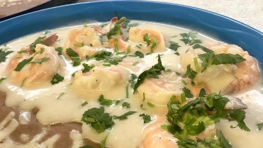 Camarones Garlic con Cilantro · Grilled Shrimp in a creamy garlic cilantro sauce with a hint of lemon. Served with Rice and Beans (Pinto, Black, Refried). Tortillas upon Request.