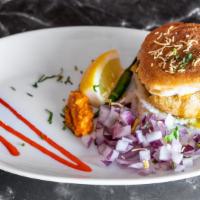 Vada Pav - 1 pc · Irresistibly Flavorful Potato balls, Sandwiched Between Two Slices Of Pav Served With Chutne...
